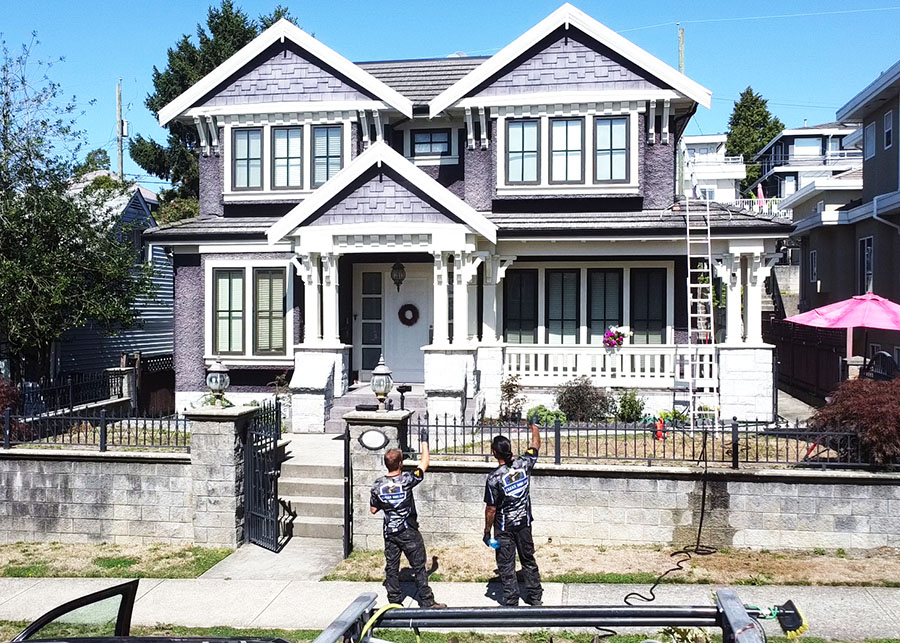 clean squad property services team members preparing to wash a home in richmond