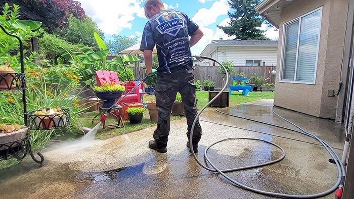 clean squad property services team member pressure washing